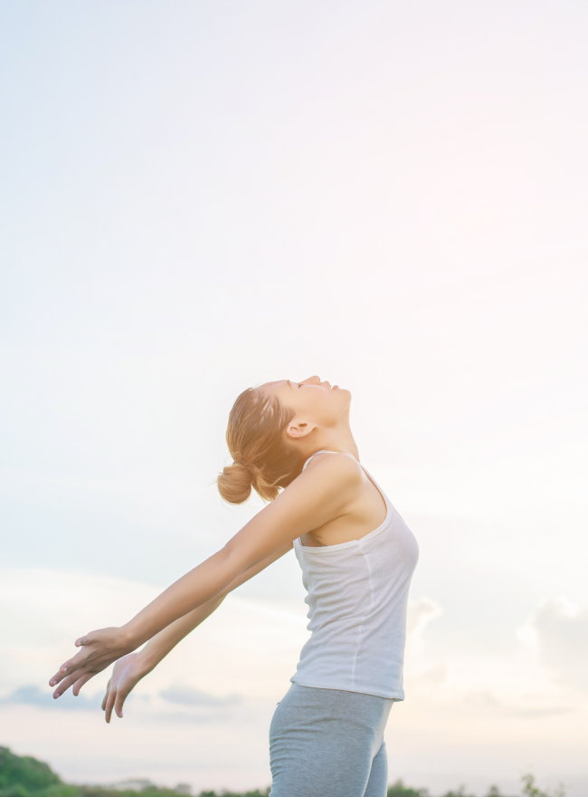 Person meditating on beach